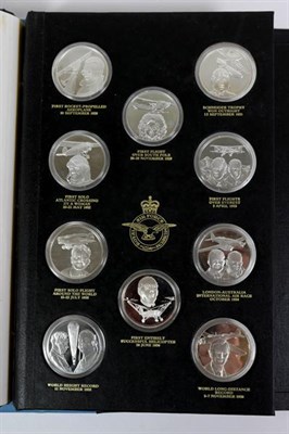 Lot 18 - THE HISTORY OF MAN IN FLIGHT, a set of fifty silver medallions each depicting a famous event within