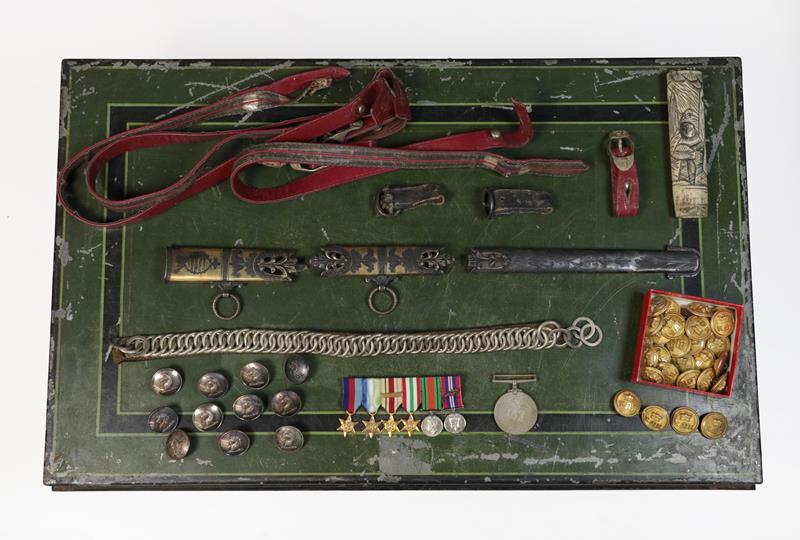 Lot 32 - A Green and Black Japanned Tin Box of Militaria, including a Second World War group of six...