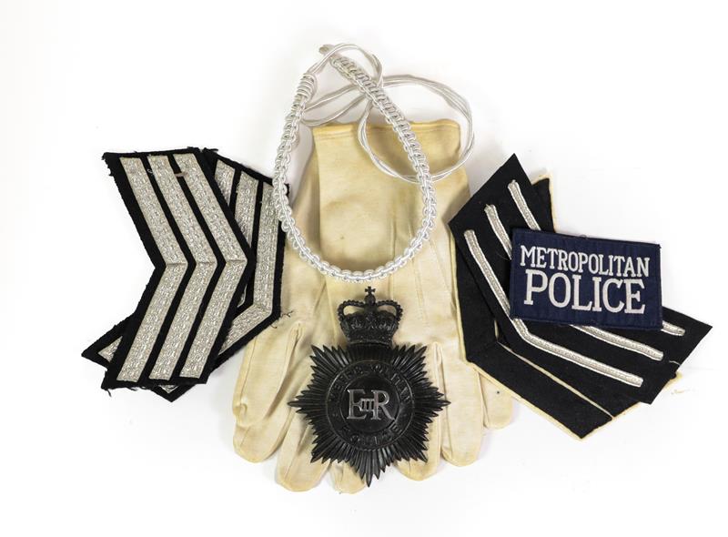 Lot 51 - A Collection of Queen Elizabeth II Metropolitan Police Items, including collar badges, rank...
