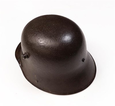 Lot 72 - A First World War German M-16 Steel Helmet, with brown patination, the leather liner with three...