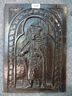 Lot 1598 - A Carved Oak Panel of William III, late 17th century, carved in relief with a guilloche...