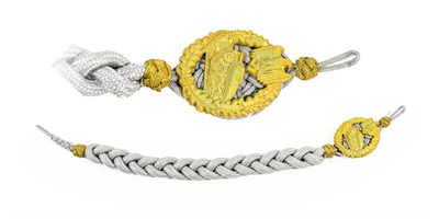 Lot 100 - A German Third Reich Panzer Marksman's Lanyard, the gilt zinc alloy badge with four prongs to...