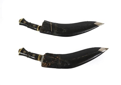 Lot 114 - Two Indian Kukris, each with curved blade prick engraved ARMY TRADERS ''SUPER'', with horn...