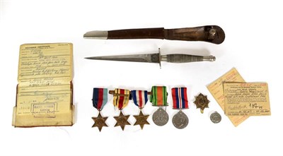 Lot 129 - A Second World War First Pattern Fairbairn Sykes Fighting Knife, the 17cm hand forged steel...