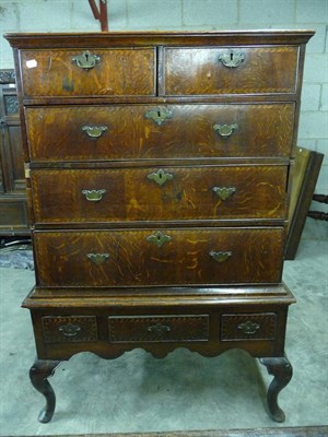 Lot 1604 - An Oak Chest on Stand, Basically 18th century, with two short above three long graduated...