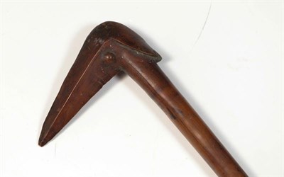 Lot 147 - A 19th Century Kanak, New Caledonia Bird-Headed Club, in a light brown smoothly patinated hard...