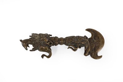 Lot 160 - A Nepalese Bronze Phurba (Ritual Dagger), with crescent shape blade, the haft and pommel cast...
