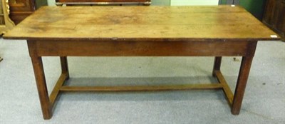 Lot 1607 - An Elm and Oak Farmhouse Table, of three plank construction over a plain frieze with single drawer