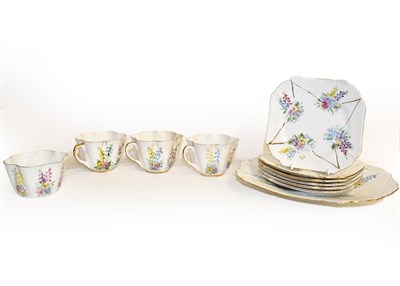 Lot 15 - A Shelley tea set (later decorated) and a Limoges Art Nouveau iridescent vase, 18cm