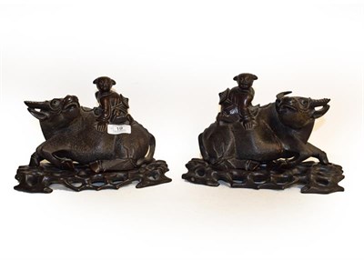 Lot 19 - A pair of wooden carved models of water buffalo, 24cm wide