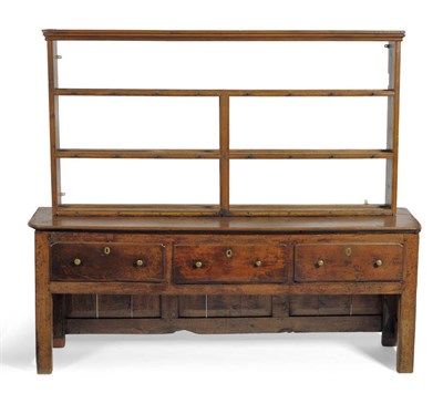 Lot 1614 - A Joined Oak Dresser, the solid top above three deep frieze drawers, enclosed panel sides and back