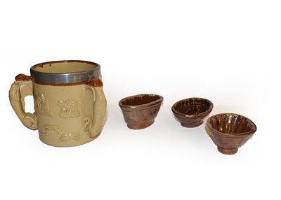 Lot 25 - A quantity of brown and salt glazed stoneware including a spirit barrel sprigged with the Royal...