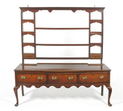 Lot 1615 - A George III Oak and Mahogany Crossbanded Low Dresser and Rack, Late 18th Century, the shaped...