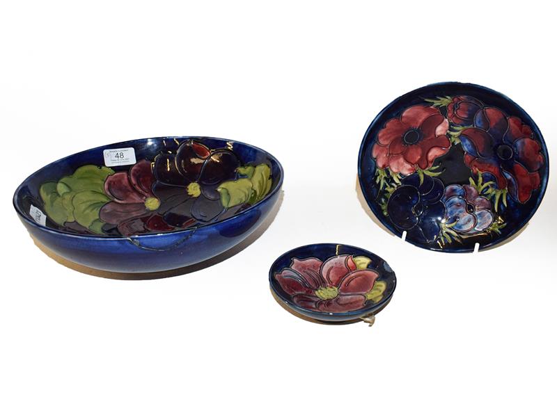 Lot 48 - Three Moorcroft bowls, Cobalt blue ground, Clematis and Anemone pattern, the largest 26.5cm...