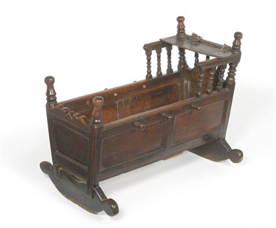 Lot 1617 - An Early 18th Century Joined Oak Crib, dated 1706 and initialled KT, with panelled sides,...