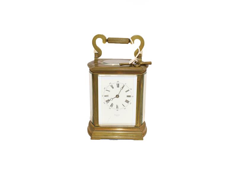 Lot 89 - A 19th century brass cased carriage clock striking on a gong, with bowed sides and having...