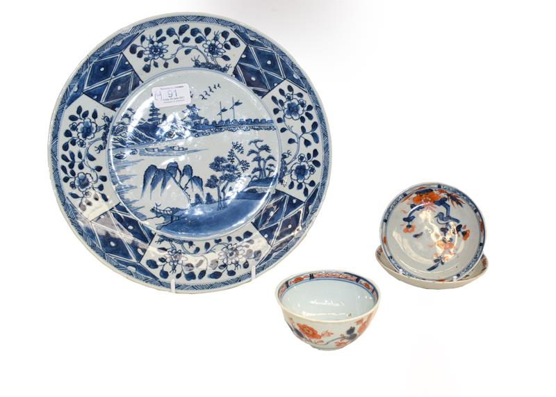 Lot 91 - An 18th century Chinese blue and white dish painted with a river landscape, together with an...