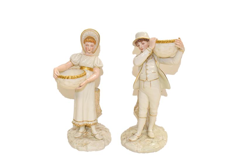 Lot 94 - A pair of Royal Worcester figures of a boy and a girl holding a basket, reclined against a tree...