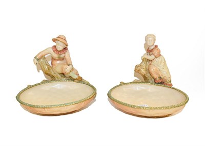 Lot 102 - A pair of Royal Worcester comports, each modelled as a boy and a girl on a tree, some dated...