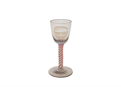 Lot 107 - An 18th century Dutch wine glass with opaque and coloured twist stem