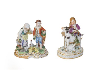 Lot 108 - A Meissen porcelain figure of a boy and goat, 20th century, the boy holding fruiting vine on a...