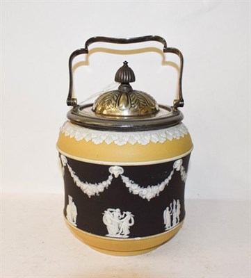 Lot 111 - A Wedgwood tricolour Jasperware biscuit barrel and a spill vase (2)