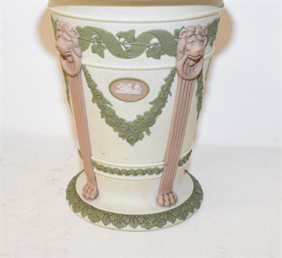 Lot 111 - A Wedgwood tricolour Jasperware biscuit barrel and a spill vase (2)