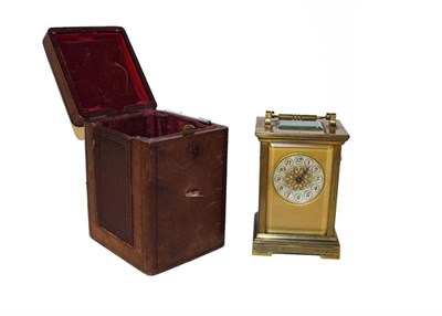 Lot 116 - A brass carriage timepiece with silvered dial, in a leather mounted case, clock 15cm
