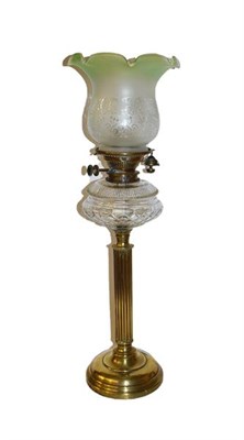Lot 134 - A brass oil lamp, another lamp, and a stick stand (3)