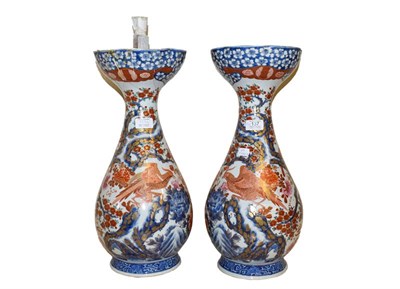 Lot 137 - A large pair of Japanese Meiji period baluster formed vases, decorated with exotic birds in...