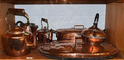 Lot 144 - Copper kettles, fish kettle, copper ware, etc (one shelf)