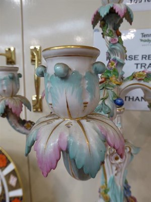 Lot 161 - A Meissen porcelain seven light figural candelabrum, late 19th century, with flower encrusted...