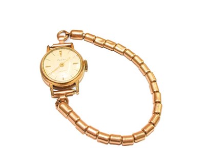 Lot 185 - A lady's 9 carat gold wristwatch, signed Omega, with attached 9 carat gold later associated...