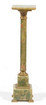 Lot 1631 - A Green Onyx and Gilt Metal Mounted Pedestal, early 20th century, the square revolving platform top