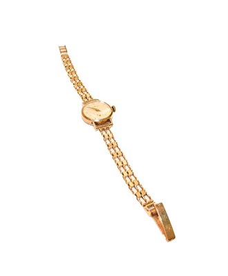 Lot 199 - A lady's 9 carat gold wristwatch signed Zenith, the bracelet with a 9 carat gold hallmark