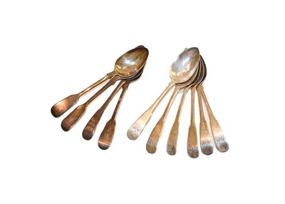 Lot 250 - A selection of George III and 19th century silver table spoons and tea spoons, 886 grams