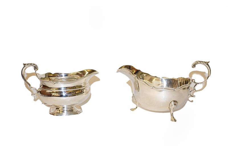 Lot 256 - Two differing George silver sauce boats, both by Ollivant and Botsford, one Sheffield, 1935,...