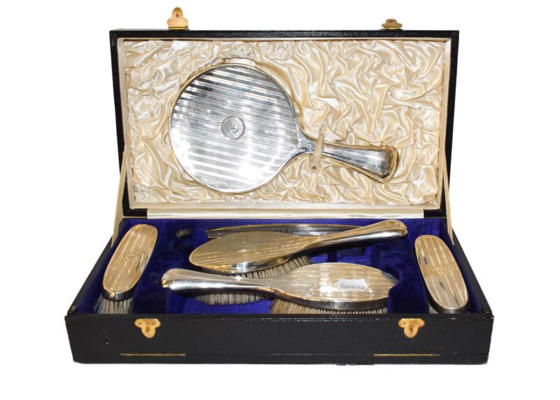 Lot 263 - A cased George V silver dressing table service, by William Hutton and Sons, Birmingham, 1913...