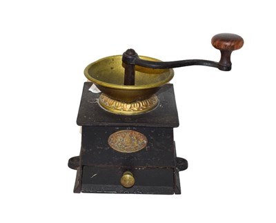 Lot 302 - A Victorian cast iron coffee grinder by A. Kenrick & Sons, together with four terracotta tiles with