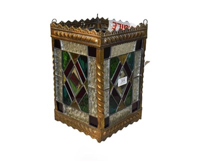 Lot 304 - A Victorian stained glass lantern with square brass frame, 20cm square by 30cm