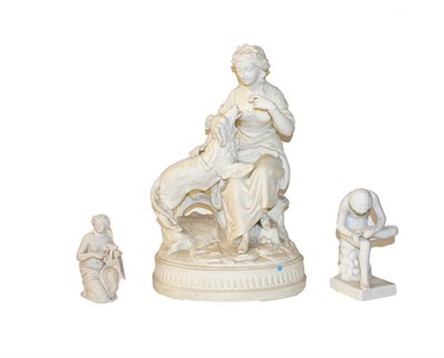 Lot 308 - A Victorian parian figure of a seated lady and a dog, 36cm, together with two similar smaller...