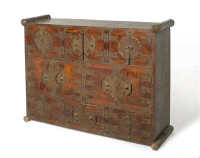 Lot 1643 - A Korean Elm and Brass Cabinet, late 19th century, of rectangular tapering form with eight...