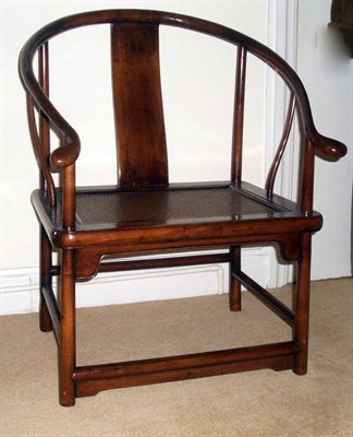 Lot 1644 - A Pair of Chinese Stained Hardwood Horseshoe Armchairs, 20th century, with U shaped top rails,...