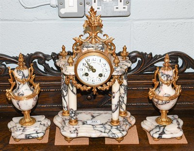 Lot 343 - A good French clock garniture with grey marble columns, with a pair of matching vases, all gilt...