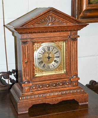 Lot 344 - An oak cased mantel clock, eight day Junghans movement, of architectural form with pendulum