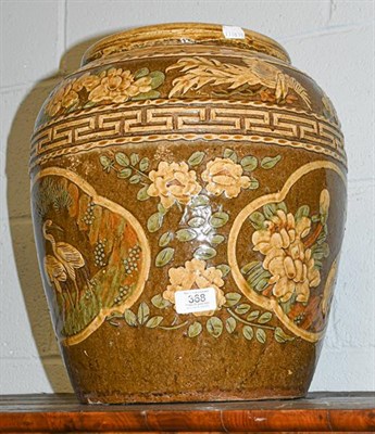 Lot 368 - A Chinese stoneware slipware finish jar decorated with cranes, 38cm high