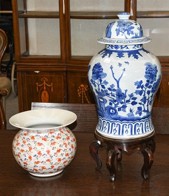 Lot 381 - A blue and white jar and cover on wooden stand, and an early 20th century flared shaped famille...