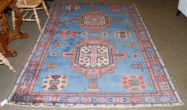Lot 1003 - An Isparta rug, the sky blue field with two cruciform medallions enclosed by Kufic borders,...