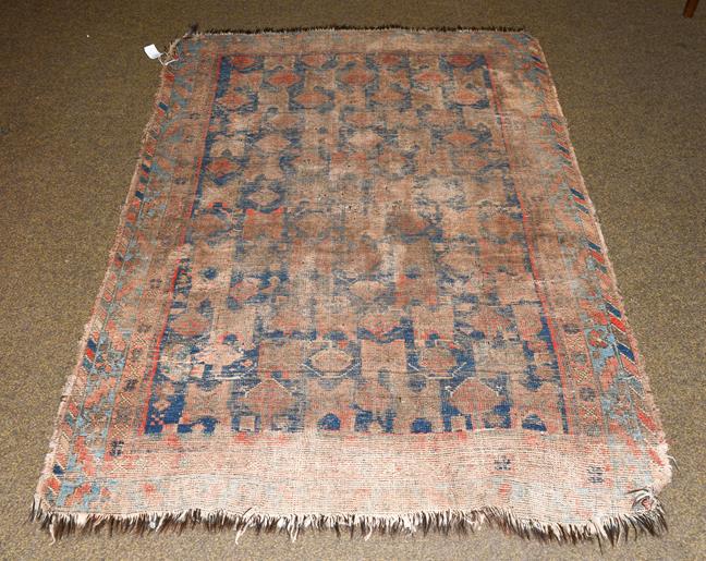 Lot 1007 - An Afshar rug, the indigo field with columns of geometric devices enclosed by serrated leaf and...