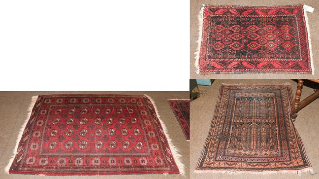 Lot 1013 - An Afghan Tekke rug, the crimson field with four rows of güls enclosed by octagon borders,...